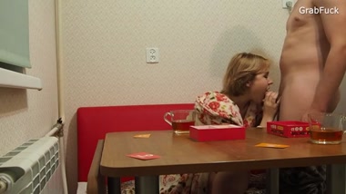 The neighbor invited her over for tea, and it all ended in hot sex right in the kitchen
